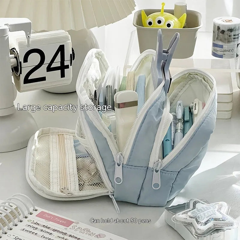 Double-layer pencil case in blue with gift handle, showing high-capacity storage for exam stationery