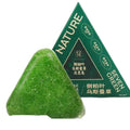 Xinjiang Wusi cypress leaf shampoo soap green solid bar on wooden surface with leaves