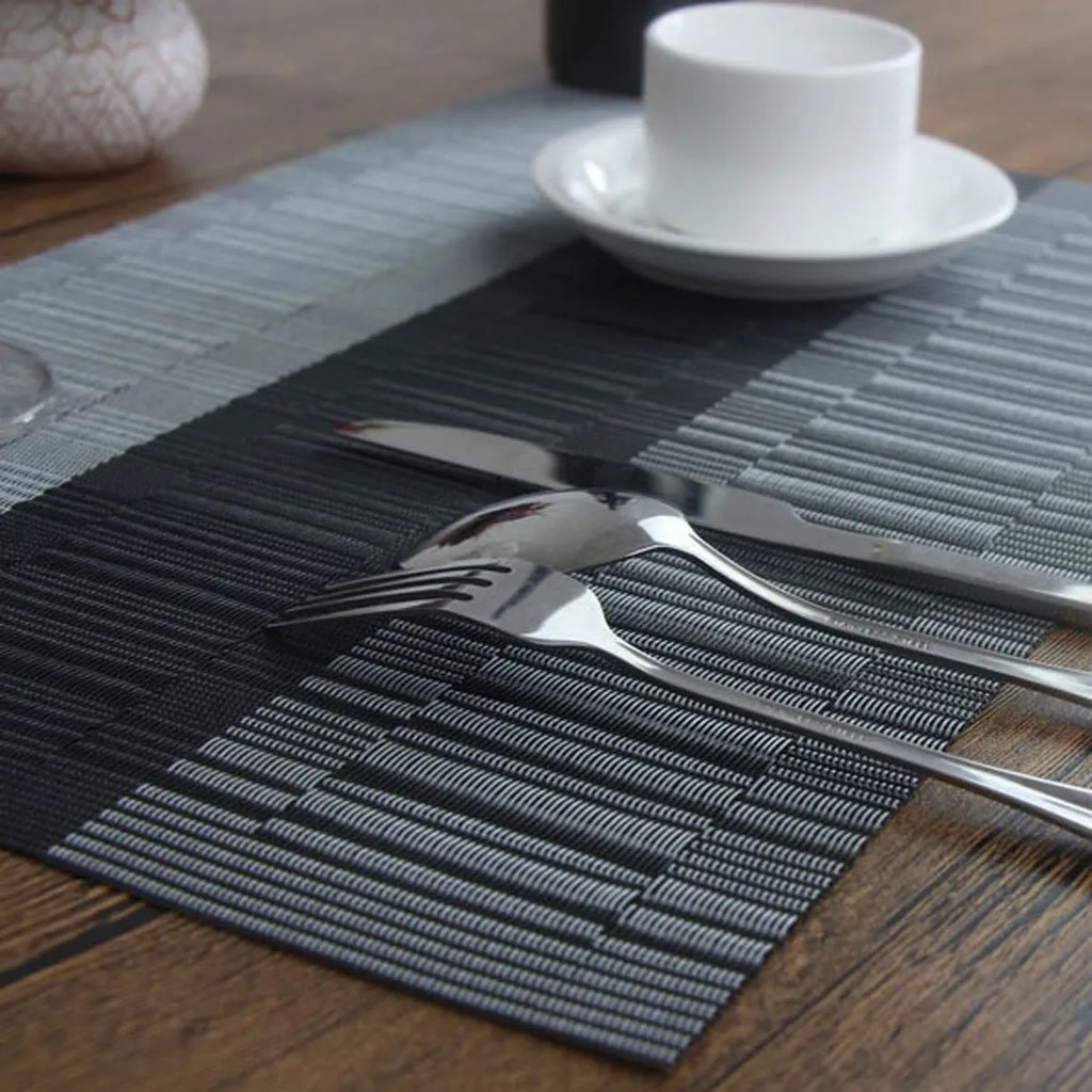 PVC non-slip placemat in gradient bamboo black on a kitchen countertop.