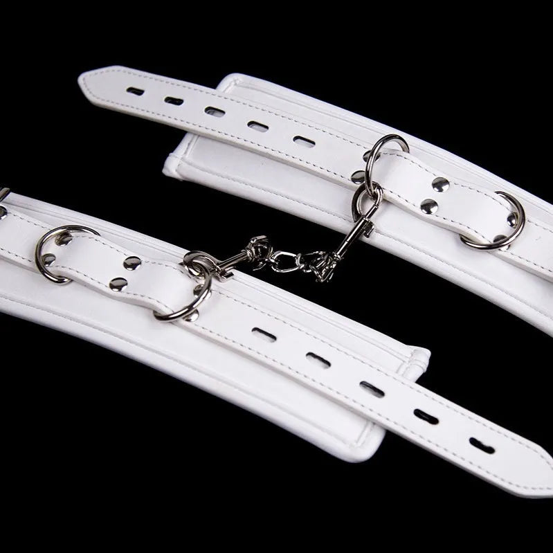 White PU sponge bondage set showing handcuffs, footcuffs and neck scarf for comfortable restraint accessories
