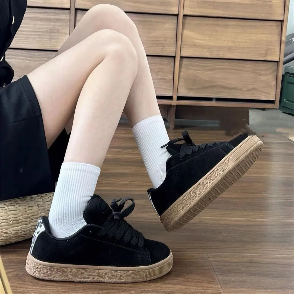 Black retro low-top sneakers with waterproof platform, round toe, and lace-up closure for men and women