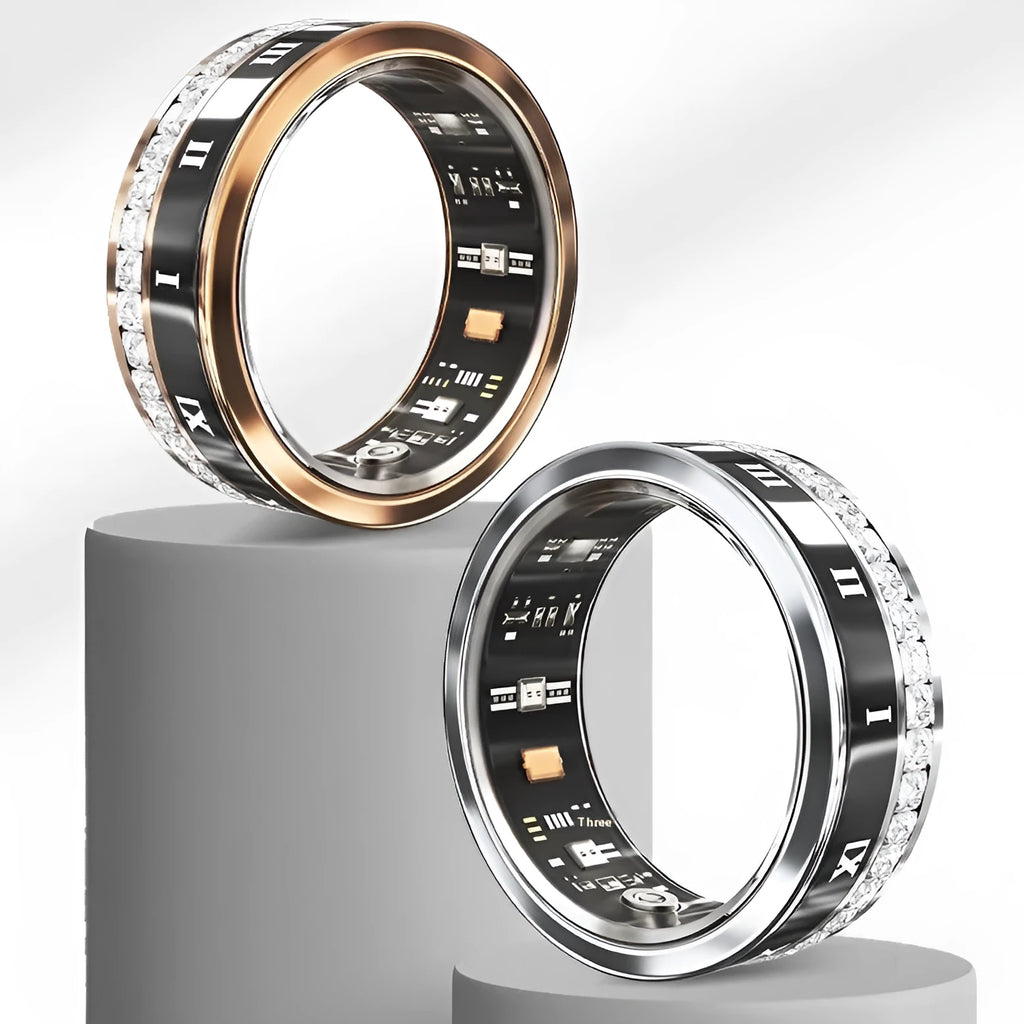 Gold and silver smart ring with diamond inlay on a finger, showing charging cable and box
