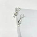 Retro-style alloy fishbone pendant necklace with adjustable chain and matching earrings.
