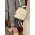 New simple college-style all-matching PU backpack in black with sewing thread detail