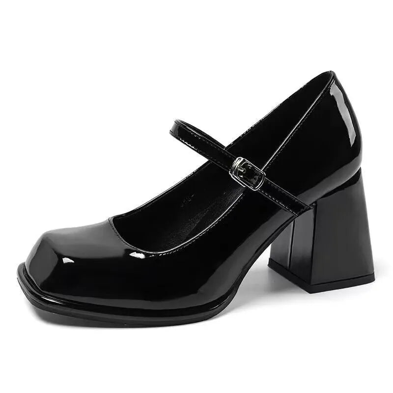 Women's retro black square toe chunky heel shoes with PU upper and buckle fastening on a white background