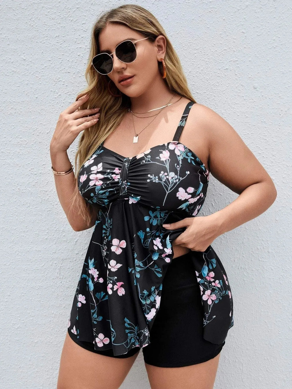 Women's floral print one-piece swimsuit with split colour design showing high elasticity fabric