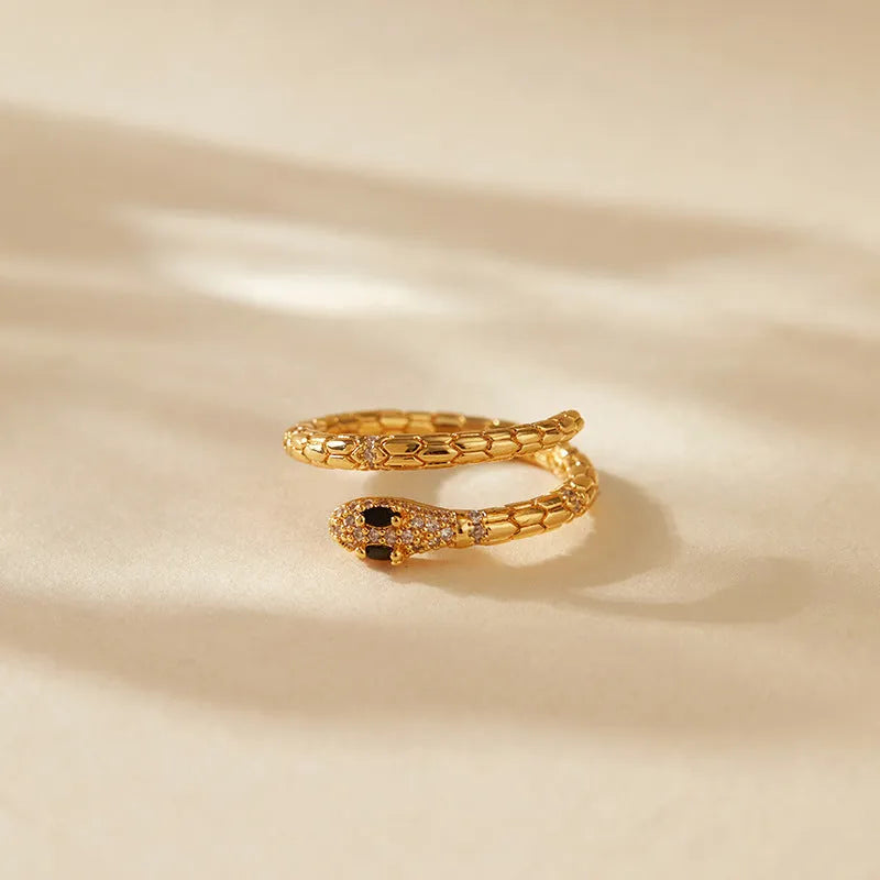 Snake-shaped adjustable finger ring with gold colour finish and detailed animal design