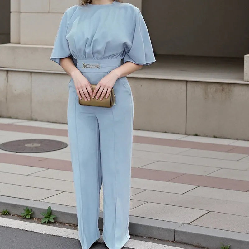 Blue men's casual polyester suit with trousers and a long-sleeve jacket on a hanger.