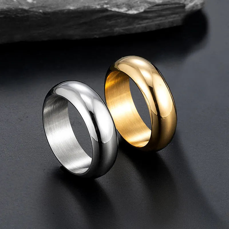 Glossy electroplated titanium steel ring shown in gold, black, and steel colour on a size chart from 7 to 12.