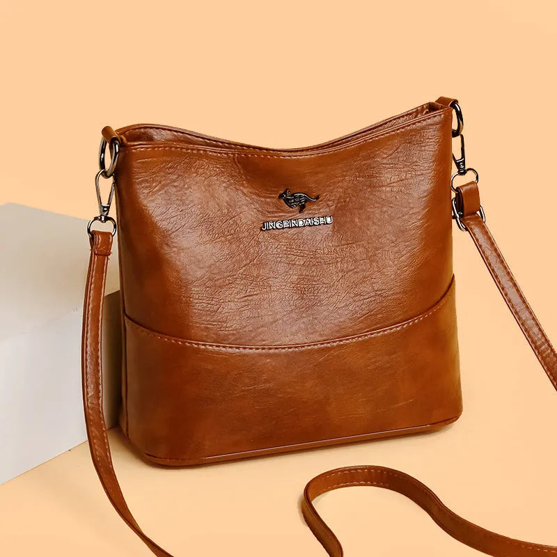 Women's solid colour soft leather shoulder bag with sewing line in black, ginger yellow, or wine red