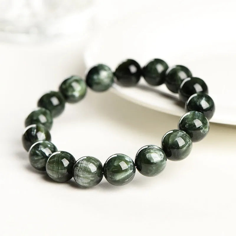 Natural green Grade 7A Dragon Crystal bracelet with 8-9mm round beads and a Ruyi design element.