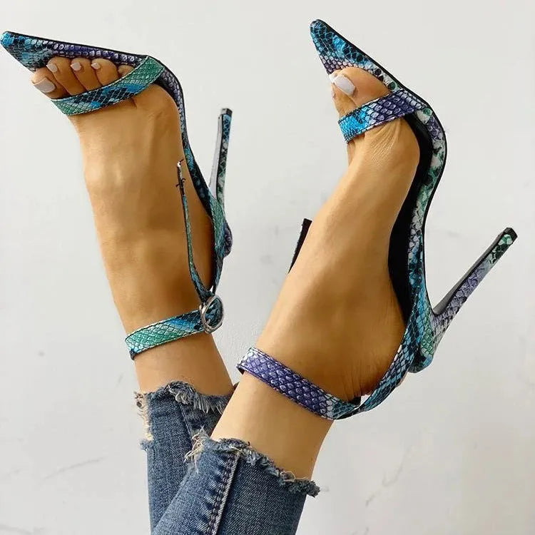Blue women's high heels with hollow out design and a buckle strap, shown in a larger size.
