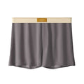 Three pairs of solid colour men's ice silk boxer shorts in loose fit mid-waist design