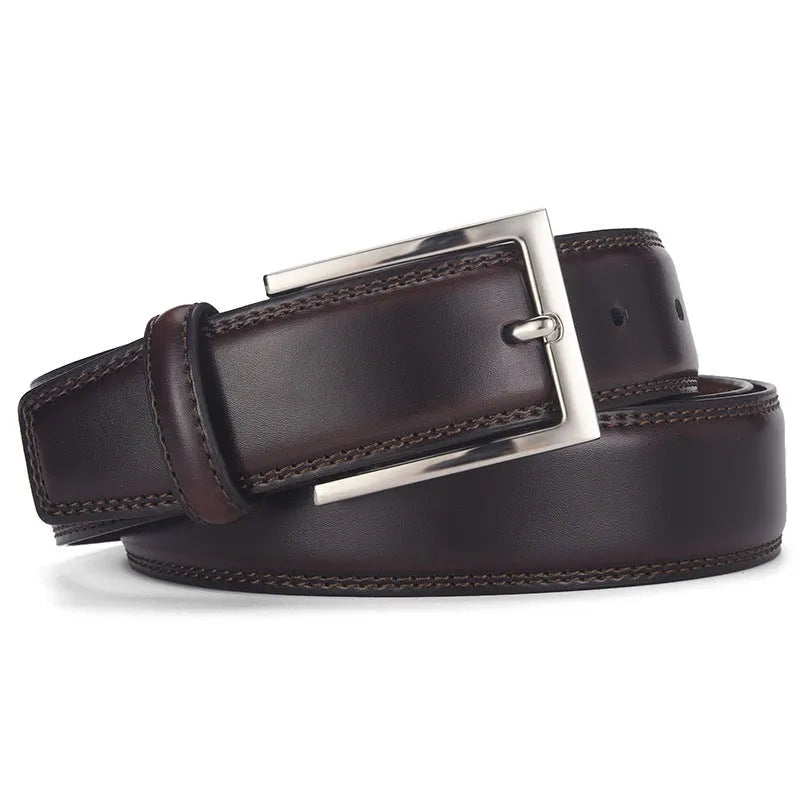Men's black genuine leather belt with a silver alloy pin buckle fastened, showing glossy patent leather finish.