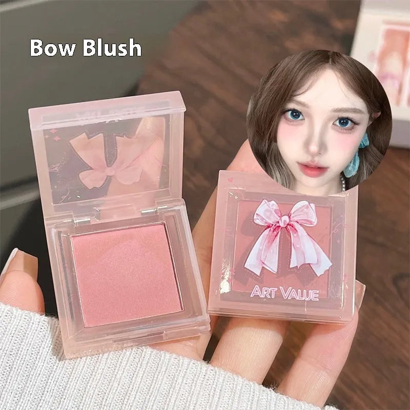 Butterfly Box makeup set showing lip mud containers, powder blusher compact, and necklace accessory with pink packaging