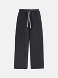 Men's black fleece-lined sweatpants with elastic drawstring waistband and loose fit trousers