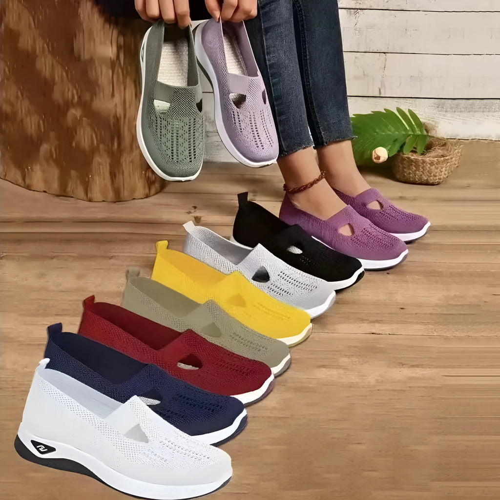 Soft-bottom casual mesh shoes with T-strap in multiple colours on a flat heel and round toe.