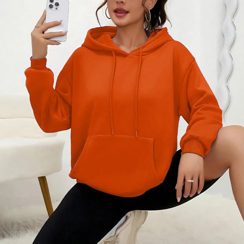 Women's loose black drawstring pocket sweatshirt with long sleeves and a front kangaroo pouch.