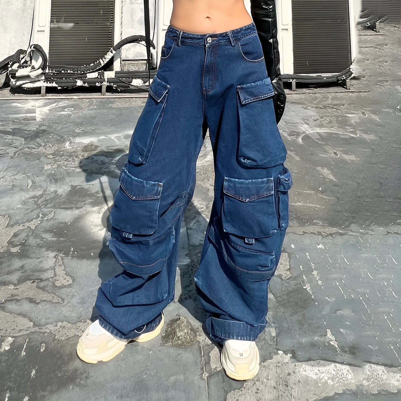 Women's dark blue distressed wide-leg high waist jeans with multiple pockets on a mannequin.