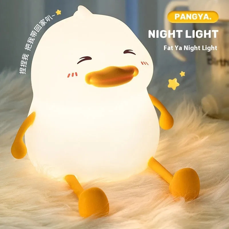 Chubby silicone night lamp with phone holder function showing compact design and adjustable LED lighting