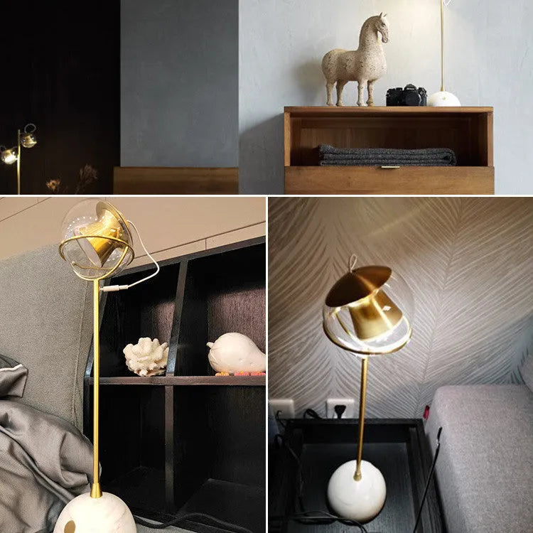 Glass desk lamp with dimmable touch control and LED light source on desk surface