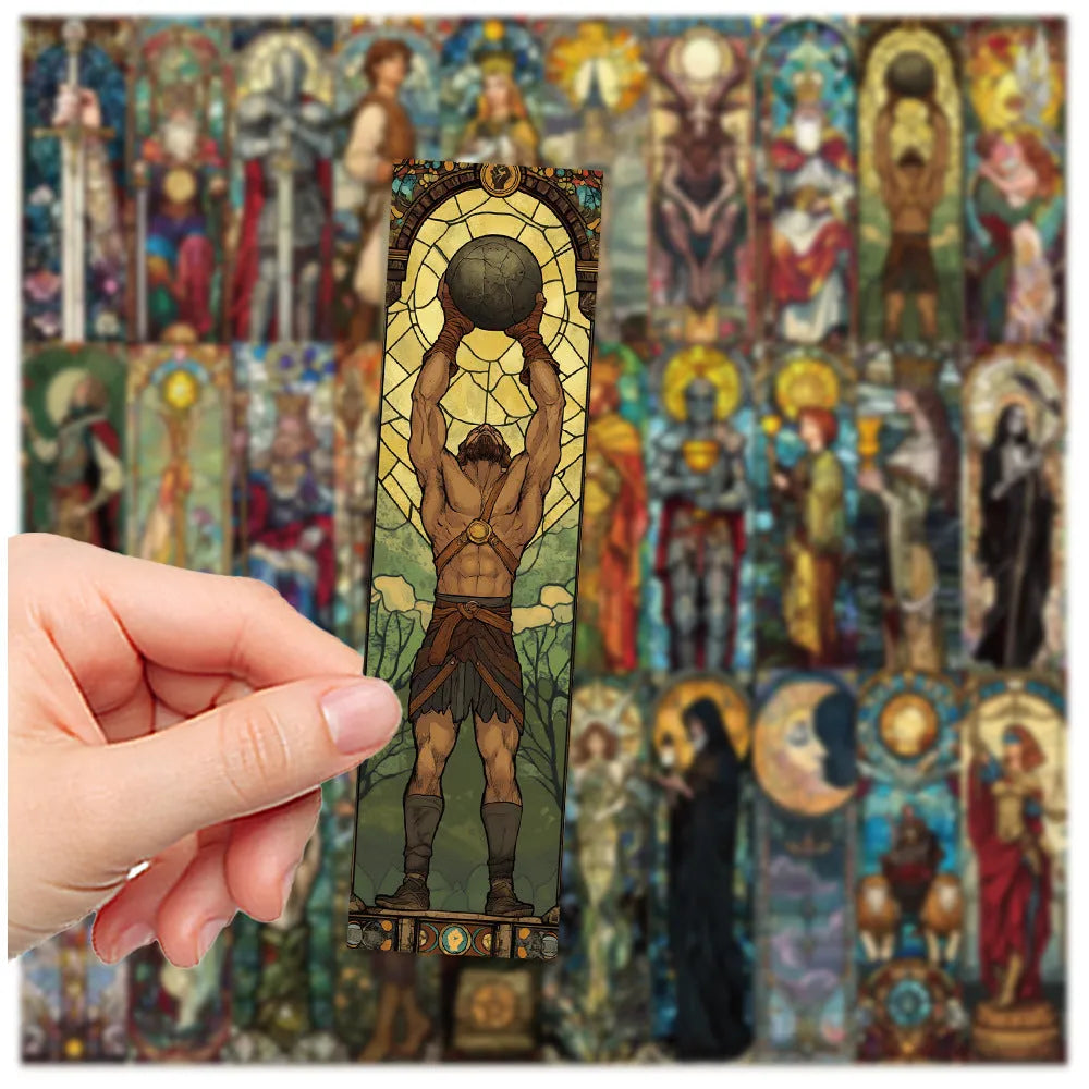 Set of 30 painted glass tarot bookmarks with cute artwork on paper, laid out flat.