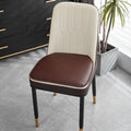 Solid-colour leather horseshoe-shaped seat cushion showing non-slip base.