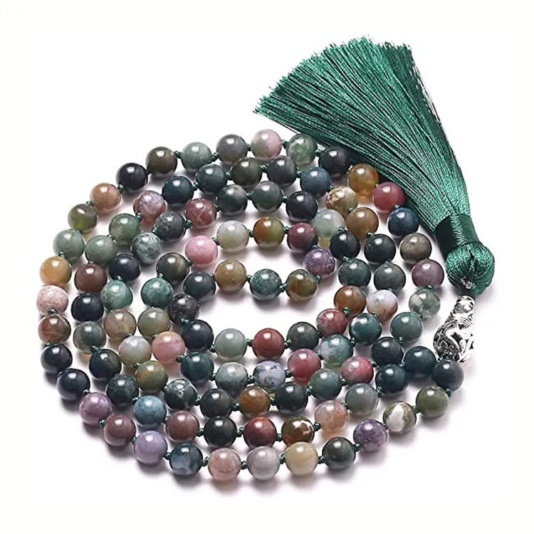 Long beaded agate and amethyst tassel necklace with blue grain stone and lapis lazuli on a geometric design.