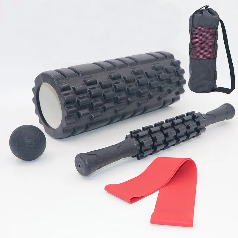 Black foam roller massage bar with gear-like segments, measuring 33cm in length
