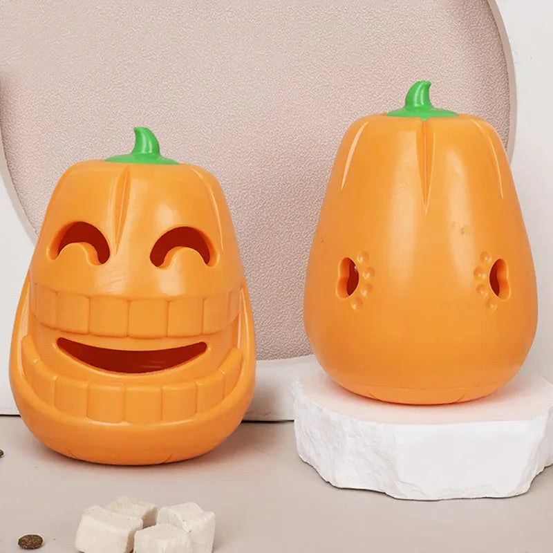 Orange Halloween pumpkin shaped dog chew toy with a funnel opening for treats.