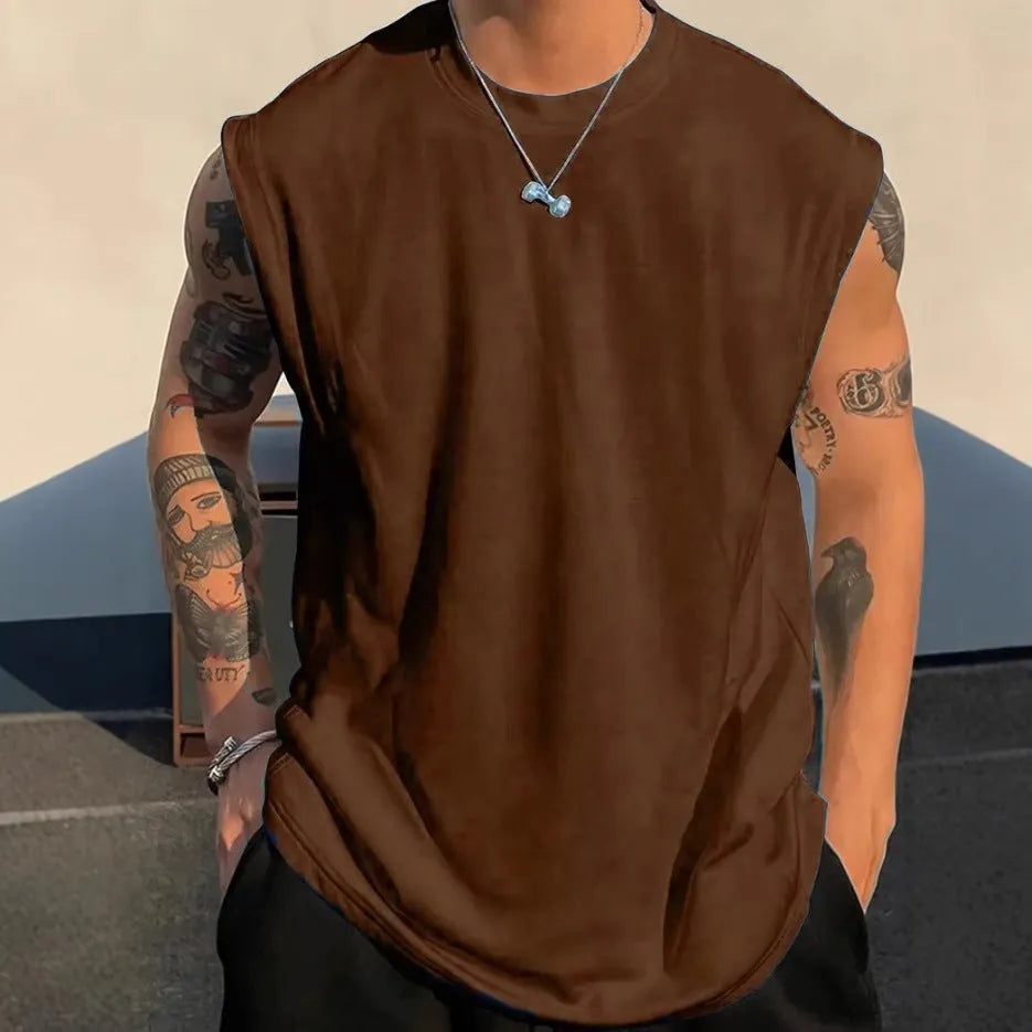 A man's loose grey cotton sleeveless t-shirt on a hanger, showing the straight hem and pullover design.