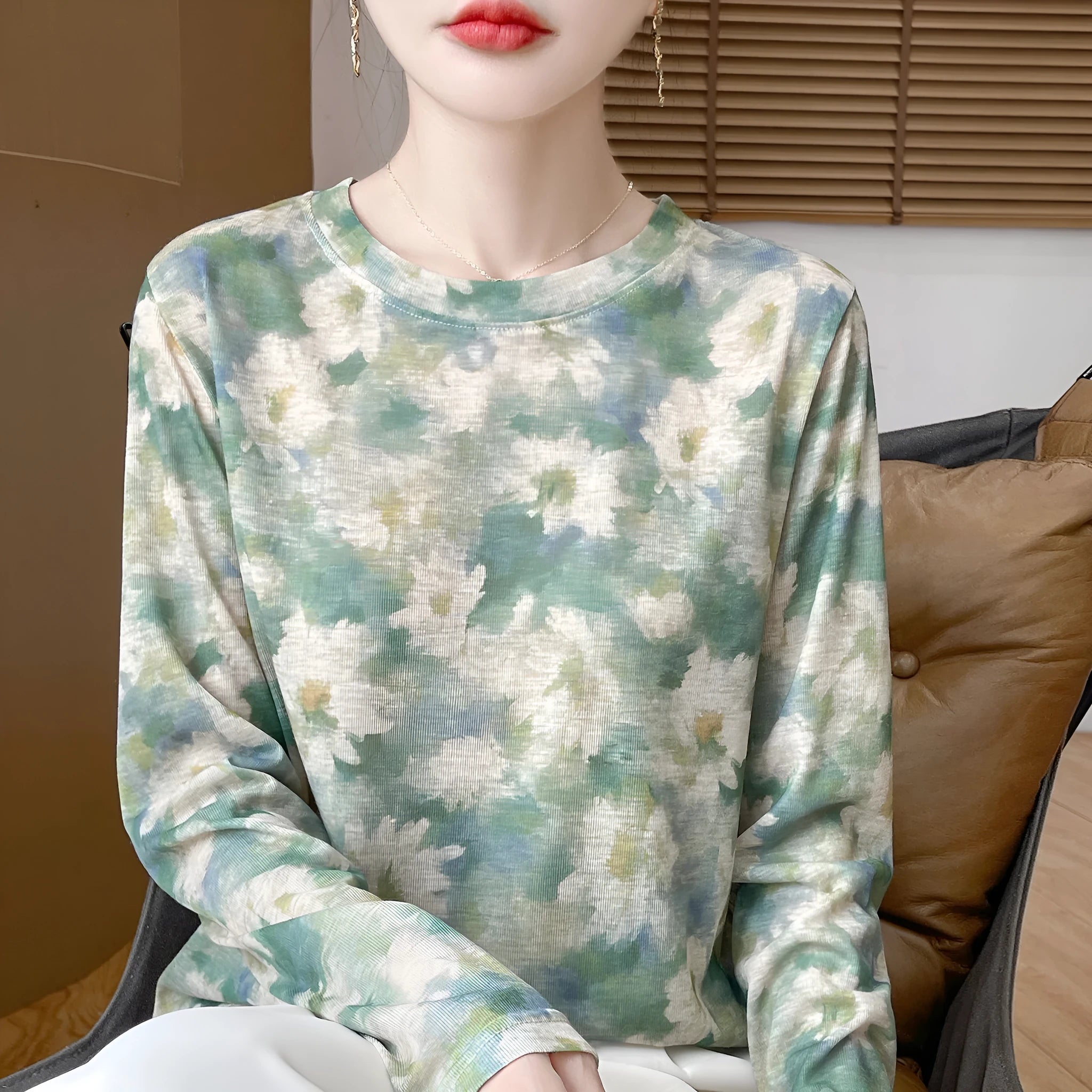 Women's round neck Tencel cotton pullover shirt in a floral print, showing front view.
