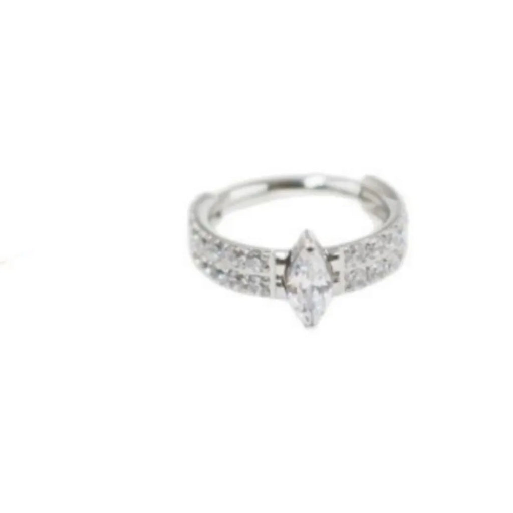Close-up of a heart-shaped zirconia earring on a 316L steel post in silver tone.