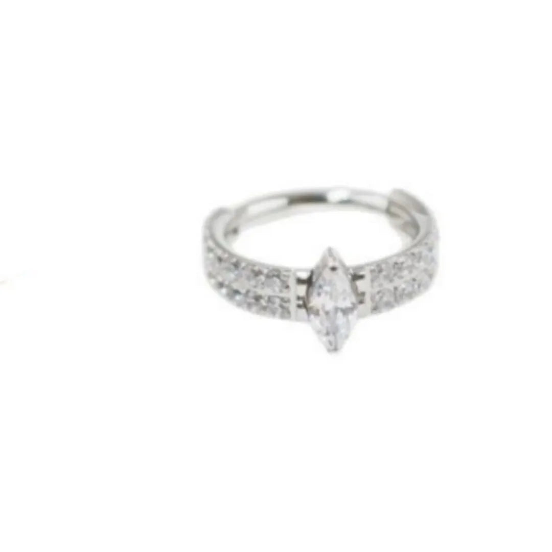 Close-up of a heart-shaped zirconia earring on a 316L steel post in silver tone.