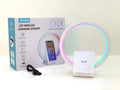 White smart Bluetooth speaker with integrated ambient light and 15W wireless charging pad on top.
