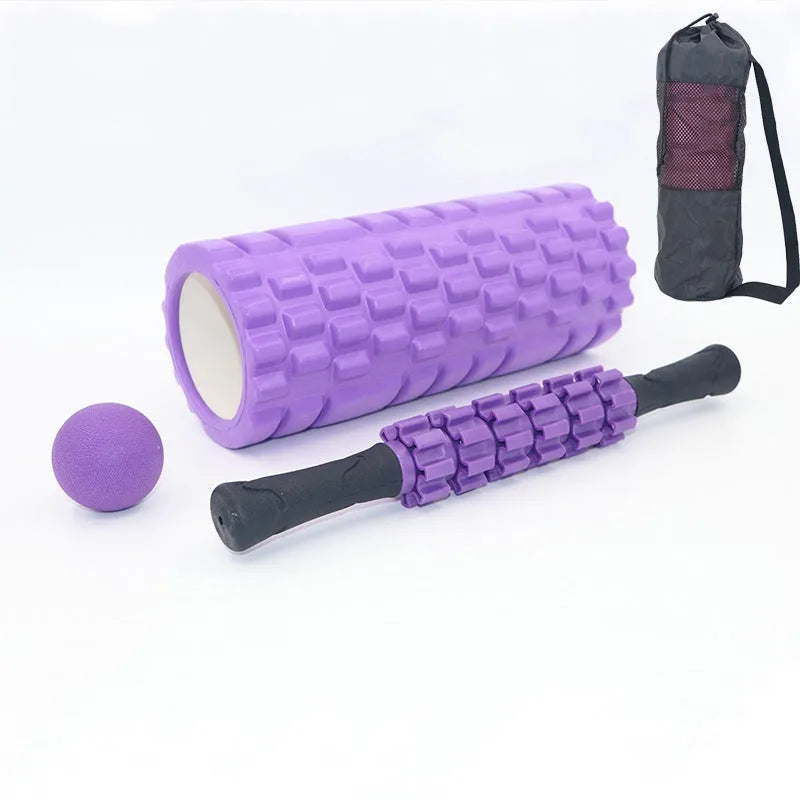 Black foam roller massage bar with gear-like segments, measuring 33cm in length
