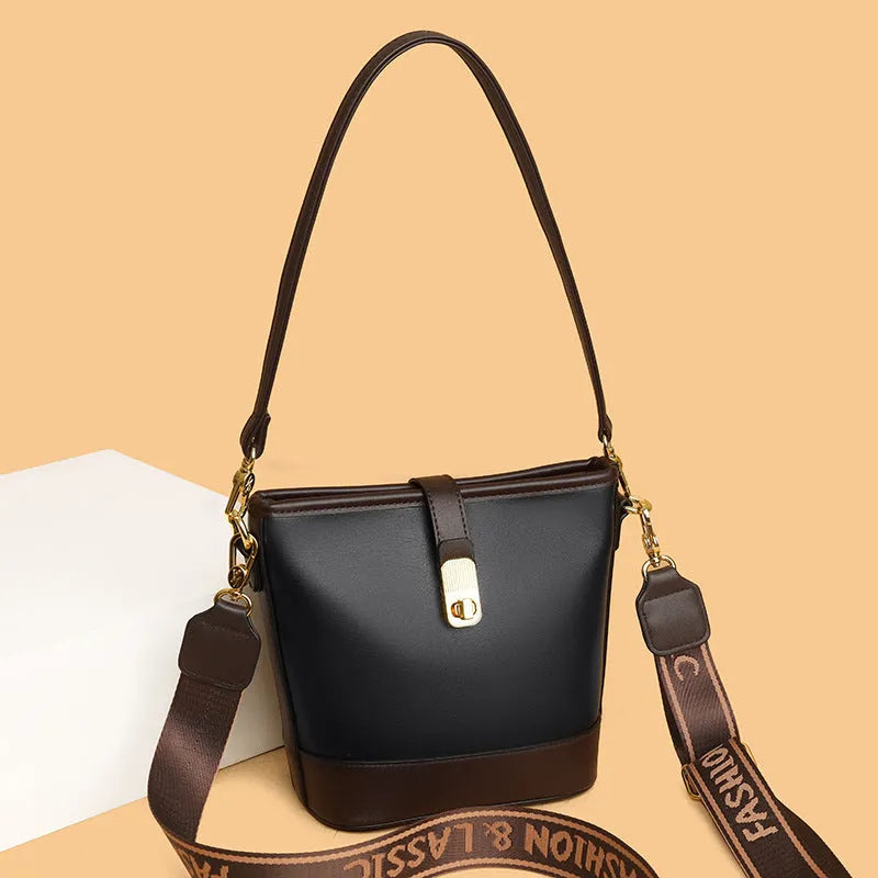 Korean style black bucket messenger bag with double shoulder straps and multiple interior compartments