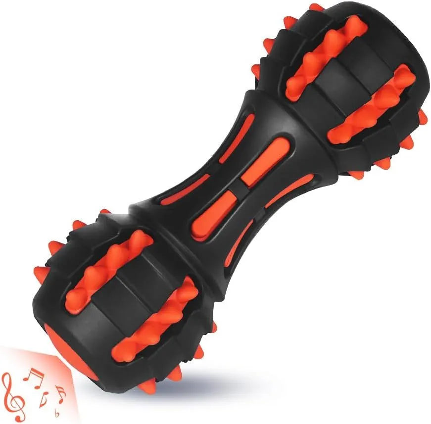 Red dumbbell-shaped rubber dog chew toy for medium and large breeds on a plain background.