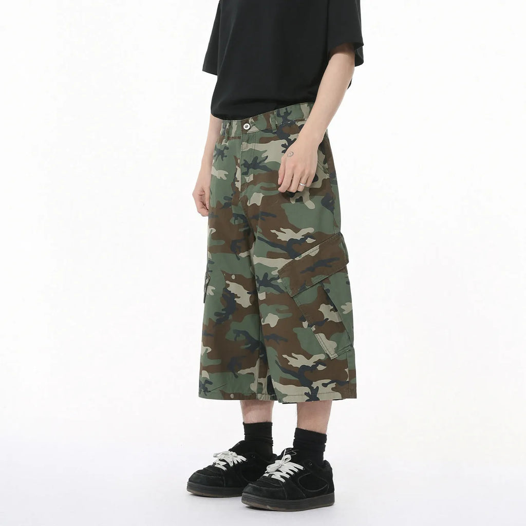 Men's cotton camouflage cargo trousers showing wide leg fit, large pockets, and side stitching details
