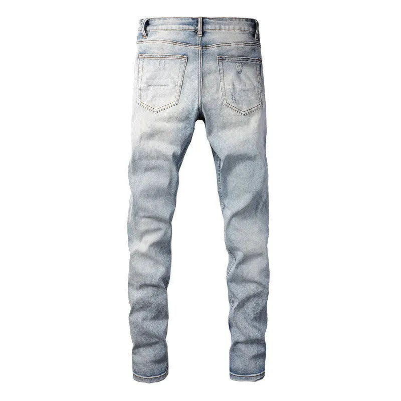 Bright white washed distressed cat beard patch ripped slim straight leg mid waist jeans cotton denim