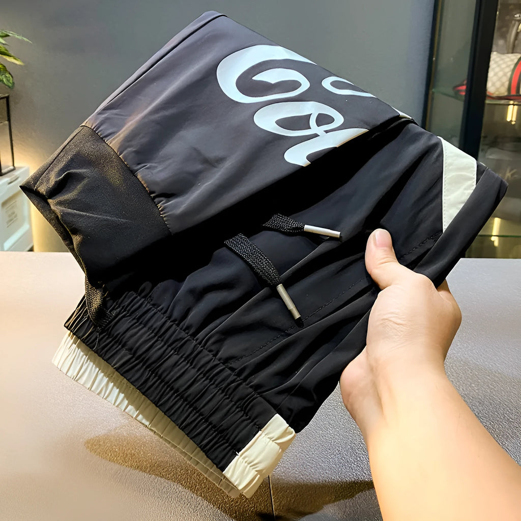 Man wearing black ultra-thin ice silk cotton ankle-banded cropped casual trousers