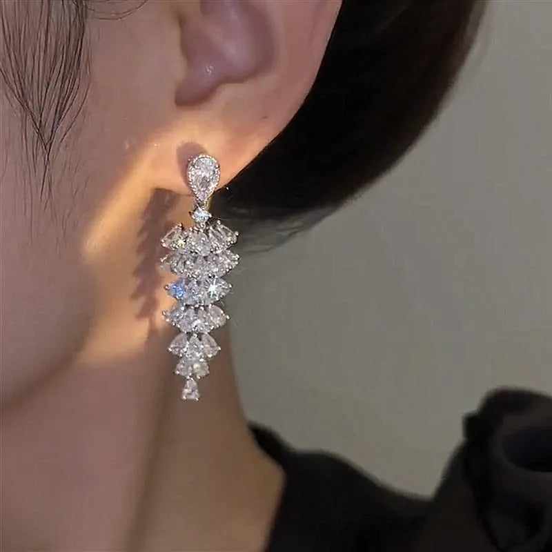 Silver pagoda-shaped Christmas tree drop earrings with sparkling zircon stones