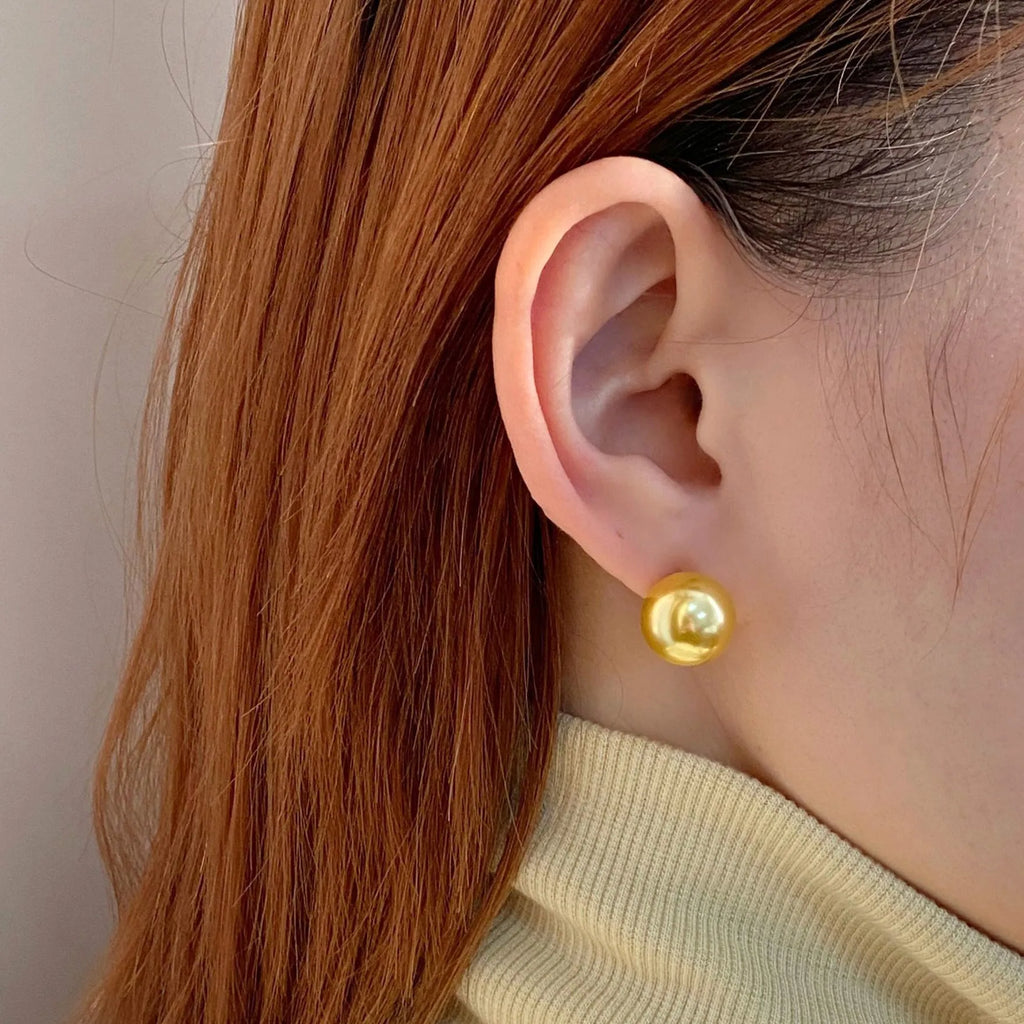 Large geometric pearl stud earrings with an Awn star setting in silver, shown in different size options.