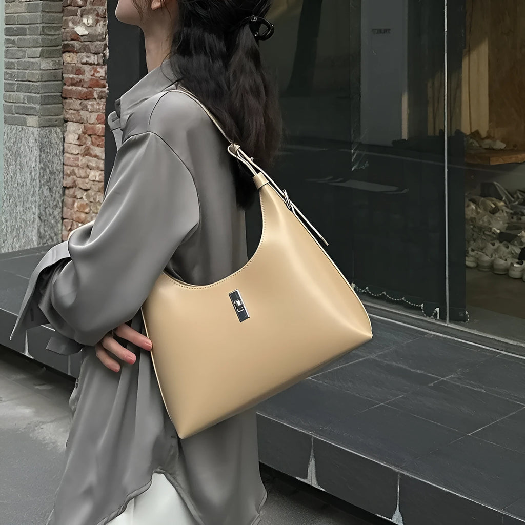 Soft brown genuine leather dumpling-shaped crossbody bag with a front sandwich pocket.