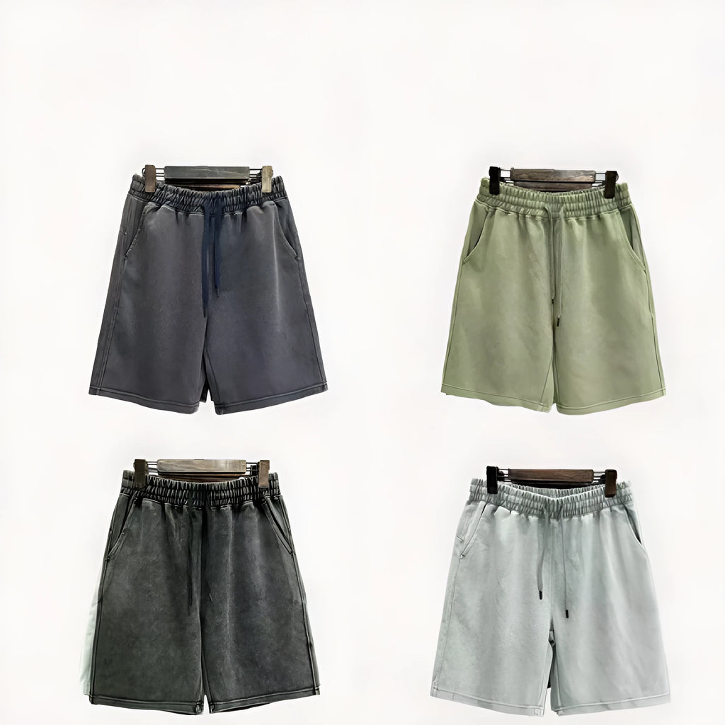 Men's navy blue distressed cotton shorts with a loose casual fit and straight legs on a plain background.