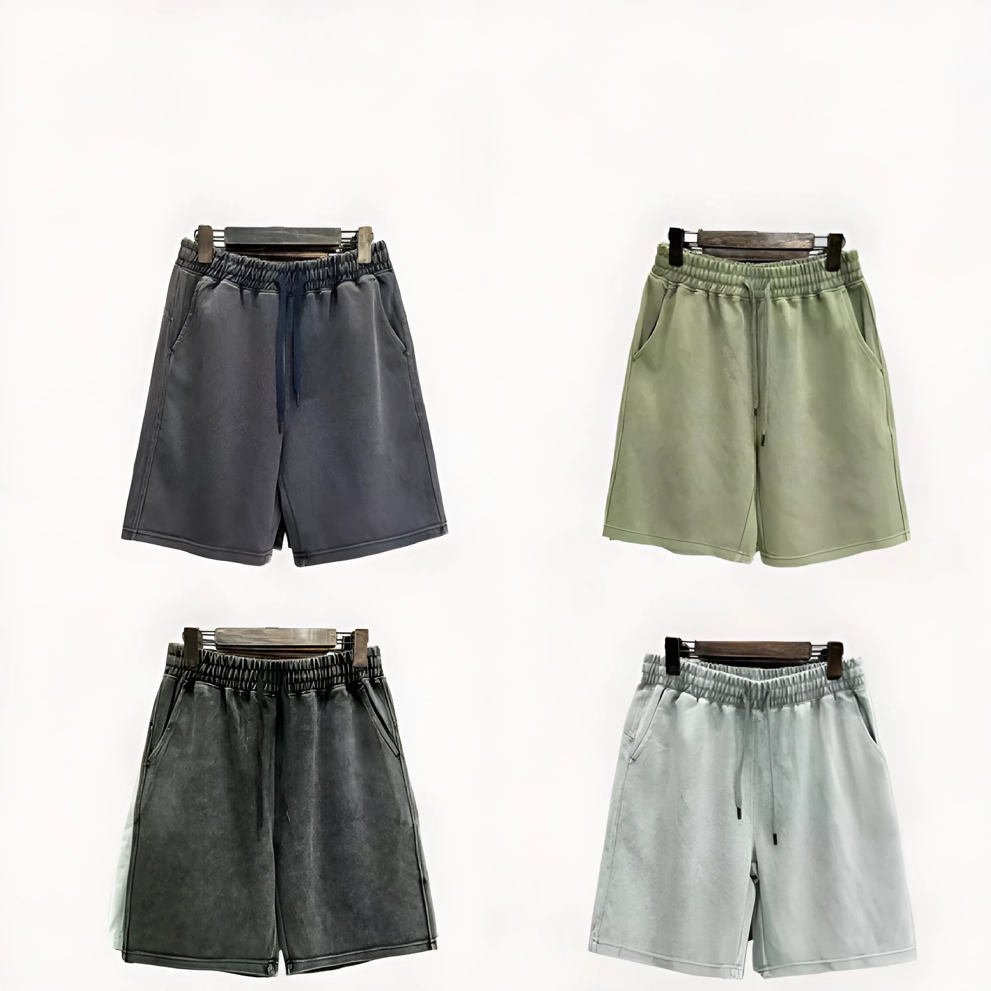Men's navy blue distressed cotton shorts with a loose casual fit and straight legs on a plain background.