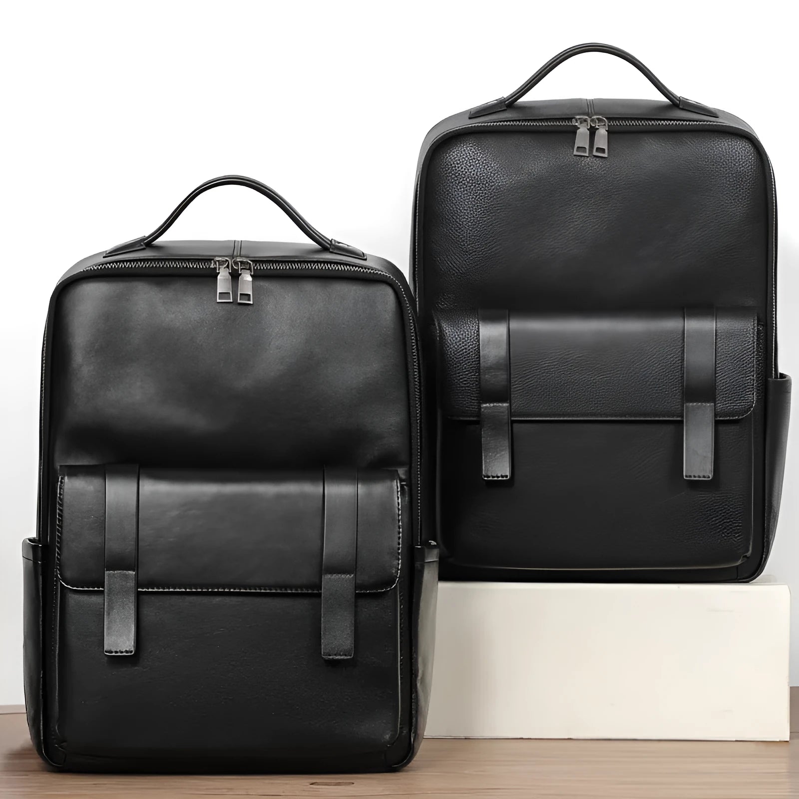Men's black genuine leather computer backpack with woven detailing and physiological curve back plate