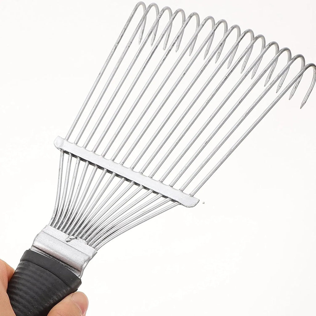 Stainless steel dematting brush rake for grooming horses and pets on a wooden surface.