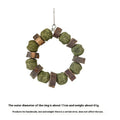 Hamster toy with applewood chew stick and colourful straw ball ring on a white background