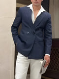 Men's classic stripe double-breasted blazer on a hanger showing the front button closure and striped pattern.